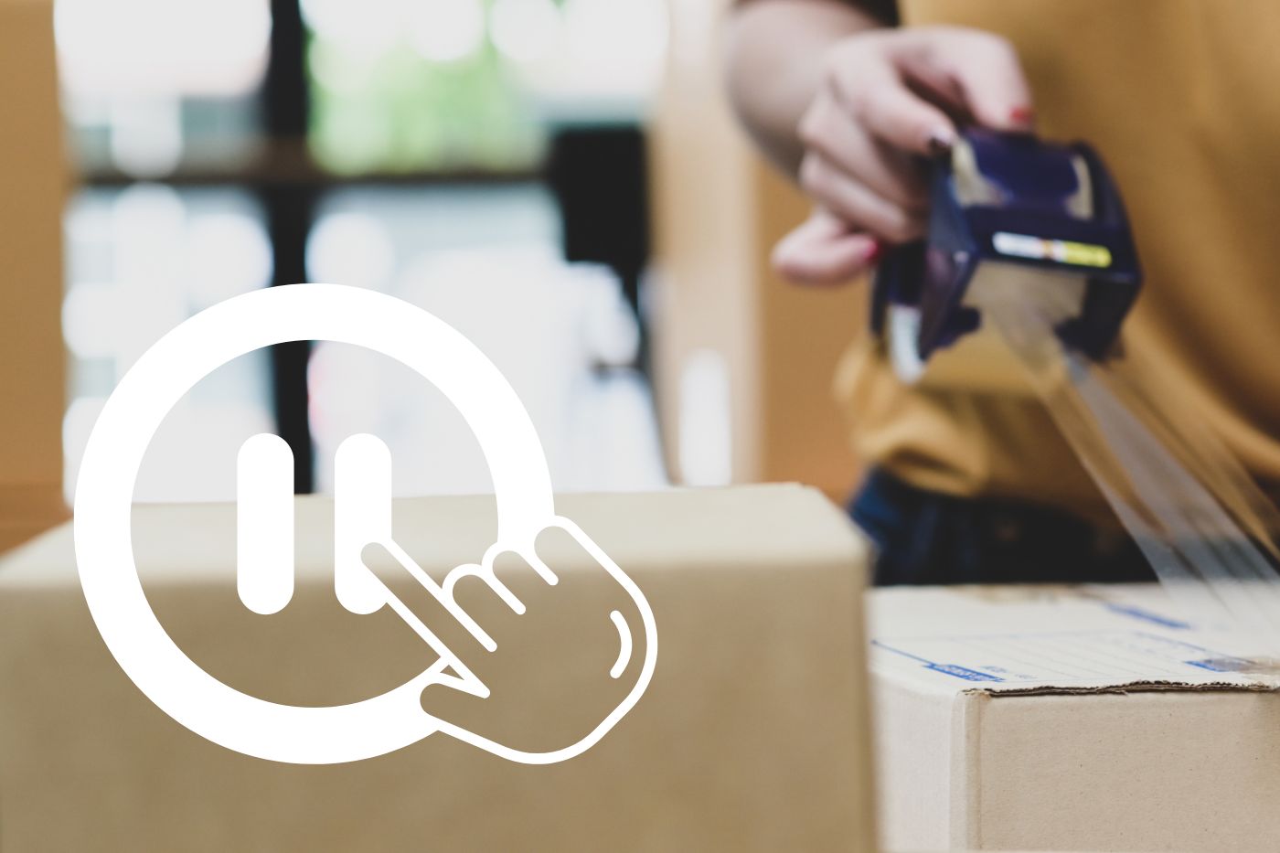 A graphic showing a pause button over boxes to be shipped.
